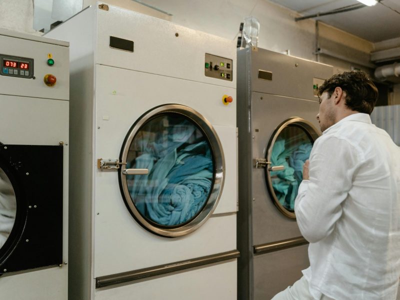 Dryer repair technician fixing heating issue in Fontana